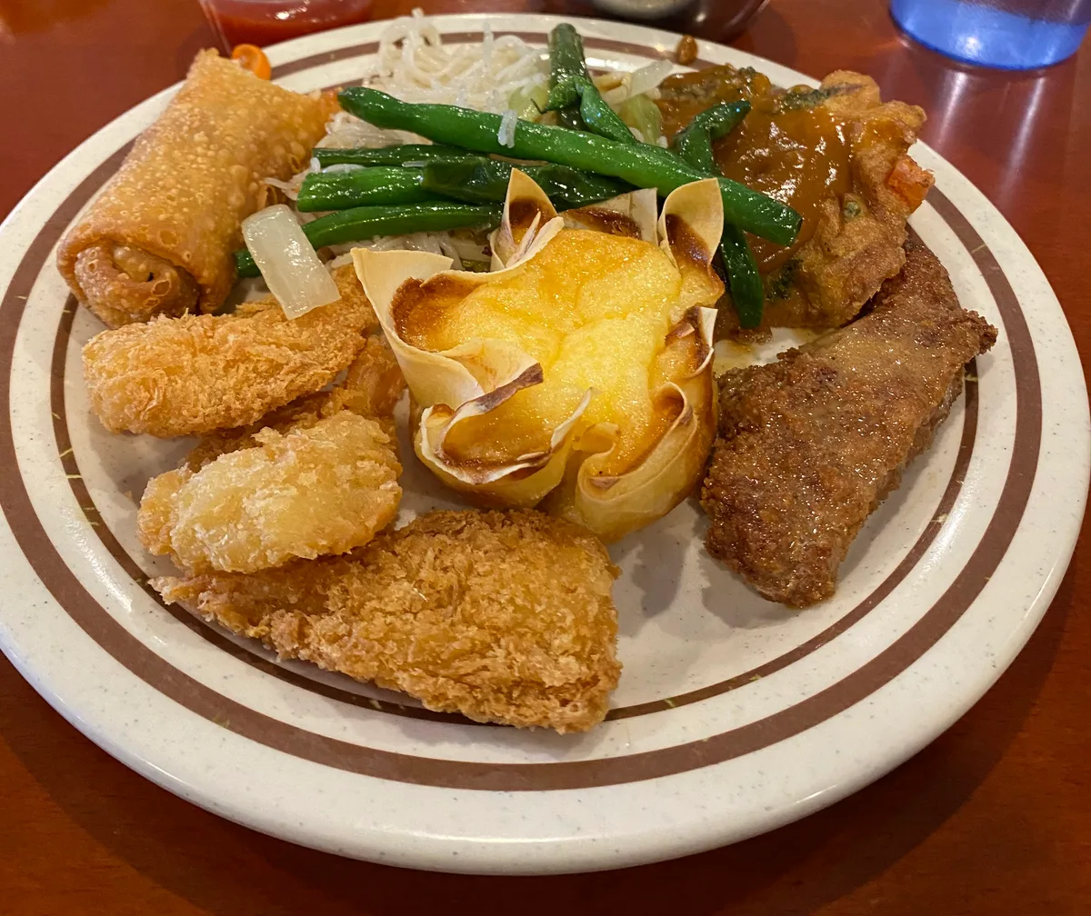 A plate of buffet food at a dining table